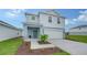 Charming two-story home with attached two car garage and front lawn landscaping at 13133 Bayberry Way, Parrish, FL 34219