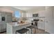 Bright modern kitchen featuring stainless appliances, stylish countertops, and white cabinets at 13133 Bayberry Way, Parrish, FL 34219