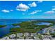 Gorgeous aerial view of waterfront homes, with community pool and tranquil water views at 1316 Perico Point Cir, Bradenton, FL 34209