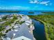 Breathtaking aerial view of waterfront condos with beautiful waterways and lush greenery at 1316 Perico Point Cir, Bradenton, FL 34209