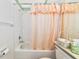 Bathroom featuring a shower with curtain and other fixtures at 1316 Perico Point Cir, Bradenton, FL 34209