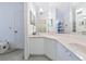 Bright bathroom features a corner sink with ample counter space and storage, for added convenience at 1316 Perico Point Cir, Bradenton, FL 34209
