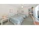 Bright bedroom with twin beds, a ceiling fan, desk, and ample storage, perfect for relaxation at 1316 Perico Point Cir, Bradenton, FL 34209
