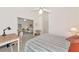 Bright bedroom featuring a desk area and view into the living room at 1316 Perico Point Cir, Bradenton, FL 34209