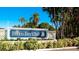Beautiful Perico Bay Club community sign amid lush tropical landscaping on a sunny day at 1316 Perico Point Cir, Bradenton, FL 34209
