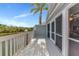 A sun-filled waterfront deck with white railings offers scenic views and outdoor living space at 1316 Perico Point Cir, Bradenton, FL 34209