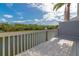 A sun-filled waterfront deck with white railings offers scenic views and outdoor living space at 1316 Perico Point Cir, Bradenton, FL 34209