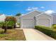 Charming home with two-car garage, well-manicured lawn, and lush landscaping at 1316 Perico Point Cir, Bradenton, FL 34209