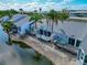 A beautiful view of waterfront townhouses with palm trees along the edge of the waterway at 1316 Perico Point Cir, Bradenton, FL 34209