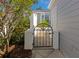 Charming courtyard gate with meticulous landscaping adds curb appeal to this lovely home at 1316 Perico Point Cir, Bradenton, FL 34209