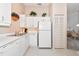 Functional kitchen with white cabinets and appliances, offering a clean, bright space at 1316 Perico Point Cir, Bradenton, FL 34209