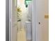 Compact laundry room with stacked washer and dryer at 1316 Perico Point Cir, Bradenton, FL 34209