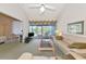 Bright living room with sliding doors to the patio and comfortable furniture at 1316 Perico Point Cir, Bradenton, FL 34209