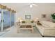 Comfortable living room featuring a sofa and side tables with lamps at 1316 Perico Point Cir, Bradenton, FL 34209