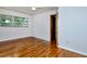 Bright bedroom featuring hardwood floors and a window overlooking the backyard at 1354 22Nd St, Sarasota, FL 34234