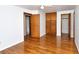 Bedroom with hardwood floors, built-in storage, and access to an en-suite bathroom at 1354 22Nd St, Sarasota, FL 34234