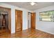 Bedroom with hardwood floors, ceiling fan and access to en-suite bathroom at 1354 22Nd St, Sarasota, FL 34234
