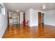 Bright living room featuring hardwood floors, a ceiling fan, fresh paint, and easy access to the kitchen at 1354 22Nd St, Sarasota, FL 34234