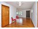 Open living room with hardwood floors, ceiling fan, and natural light from the windows at 1354 22Nd St, Sarasota, FL 34234