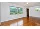 Bright living room featuring hardwood floors, neutral walls, and a large window providing natural light at 1354 22Nd St, Sarasota, FL 34234
