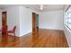 Spacious living room featuring hardwood floors, neutral walls, and ample natural light from the large windows at 1354 22Nd St, Sarasota, FL 34234