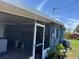The exterior of the house shows a screen porch addition at 1506 S 78Th S St, Tampa, FL 33619