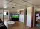 Cozy living room with a large TV and open access to other rooms at 1506 S 78Th S St, Tampa, FL 33619