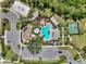 Bird's eye view of community amenities including a swimming pool, playground, spa, and a tennis and basketball court at 15316 Shady Palms Ln, Nokomis, FL 34275