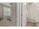 This is a bathroom with a shower-tub combination and coordinated fixtures at 15316 Shady Palms Ln, Nokomis, FL 34275