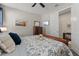 This is a spacious bedroom with comfortable furnishings and a mounted television for entertainment at 15316 Shady Palms Ln, Nokomis, FL 34275