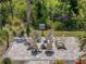 Community fire pit with seating area, providing an inviting outdoor gathering space with landscaping at 15316 Shady Palms Ln, Nokomis, FL 34275