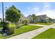 Charming single-Gathering home featuring a well-manicured lawn, lush landscaping, and a welcoming two-car garage at 15316 Shady Palms Ln, Nokomis, FL 34275
