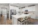 Bright kitchen showcasing a large island, stainless steel appliances, and ample cabinet space at 15316 Shady Palms Ln, Nokomis, FL 34275