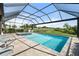 Large screened-in pool area with a spa, fountains, and views of the landscaped backyard at 15316 Shady Palms Ln, Nokomis, FL 34275