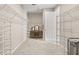 Spacious walk-in closet featuring built-in shelving and a vanity area at 15316 Shady Palms Ln, Nokomis, FL 34275