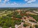 Aerial shot showing the parcel of land including the home and outbuildings at 15440 County Road 675, Parrish, FL 34219