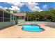 Enjoy the refreshing kidney-shaped pool and spa surrounded by a spacious patio, perfect for outdoor fun at 15440 County Road 675, Parrish, FL 34219