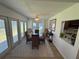 Bright dining area features hardwood floors and sliding door access to the outside at 1553 Stewart Dr # 513, Sarasota, FL 34232
