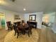 Dining room with hardwood floor and natural light coming through the living room at 1553 Stewart Dr # 513, Sarasota, FL 34232