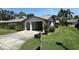 Charming one-story villa with a carport and well-manicured lawn at 1553 Stewart Dr # 513, Sarasota, FL 34232