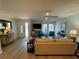 A bright living room is staged with neutral furniture and light walls at 1553 Stewart Dr # 513, Sarasota, FL 34232