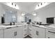 Bathroom featuring modern double sinks with marble countertops and sleek fixtures at 17333 Savory Mist Cir, Bradenton, FL 34211