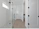 Modern bathroom with glass shower, mosaic tile floor, and contemporary fixtures at 17333 Savory Mist Cir, Bradenton, FL 34211