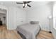 Bright bedroom features wood floors, ceiling fan, large closet, and neutral decor at 17333 Savory Mist Cir, Bradenton, FL 34211