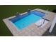 Modern pool design with integrated steps and stylish accents, perfect for relaxation and entertaining at 17333 Savory Mist Cir, Bradenton, FL 34211