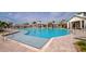 Resort-style pool area with lounge chairs and clear blue water, perfect for relaxation and recreation at 17333 Savory Mist Cir, Bradenton, FL 34211