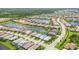 Aerial view of the house in a community near a lake and green spaces at 17910 Waterville Pl, Lakewood Ranch, FL 34202