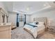 Calming bedroom featuring tray ceiling and ample natural light at 17910 Waterville Pl, Lakewood Ranch, FL 34202