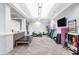 Community gym featuring modern equipment, exercise balls, wall-mounted TV, and padded benches at 17910 Waterville Pl, Lakewood Ranch, FL 34202