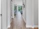 Inviting hallway leading to the living area and a view of the pool at 17910 Waterville Pl, Lakewood Ranch, FL 34202
